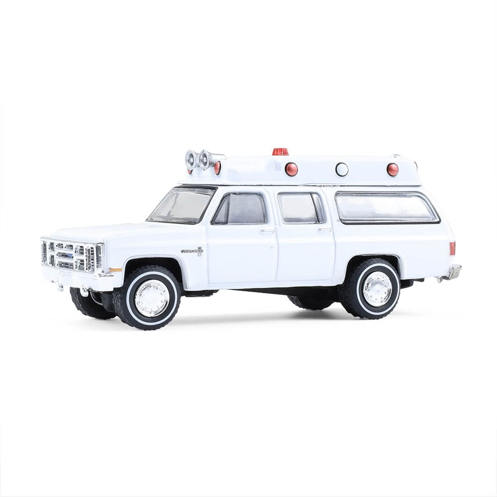 Greenlight Collectibles - Ambulance Chevrolet Suburban Custom Deluxe 1983 - Échelle 1/64
