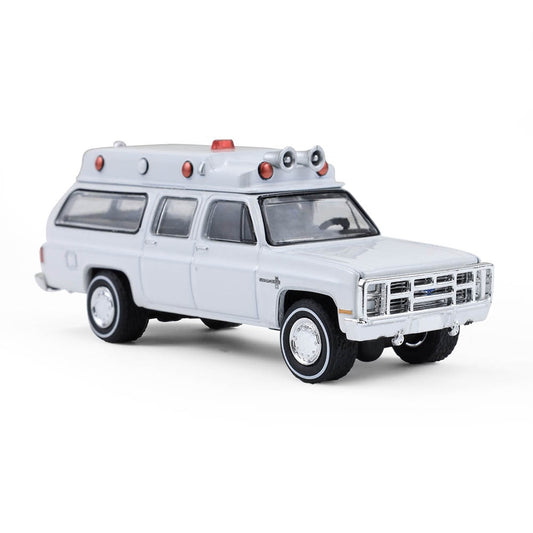 Greenlight Collectibles - Ambulance Chevrolet Suburban Custom Deluxe 1983 - Échelle 1/64