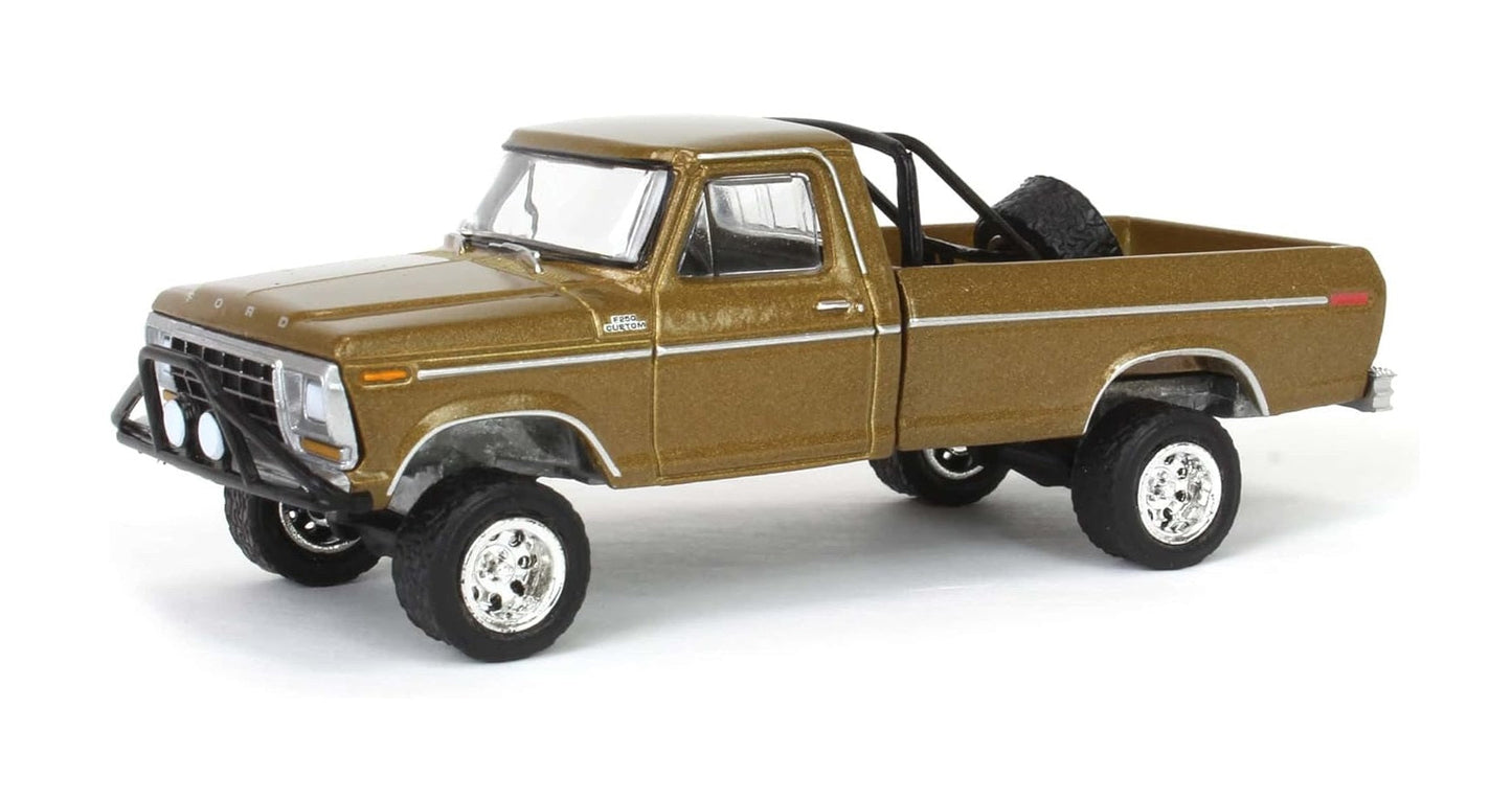 Greenlight - 1979 Ford F250 Ranger Lifted Rollbar Mounted Spare Gold - Series All Terrain - Scale 1/64