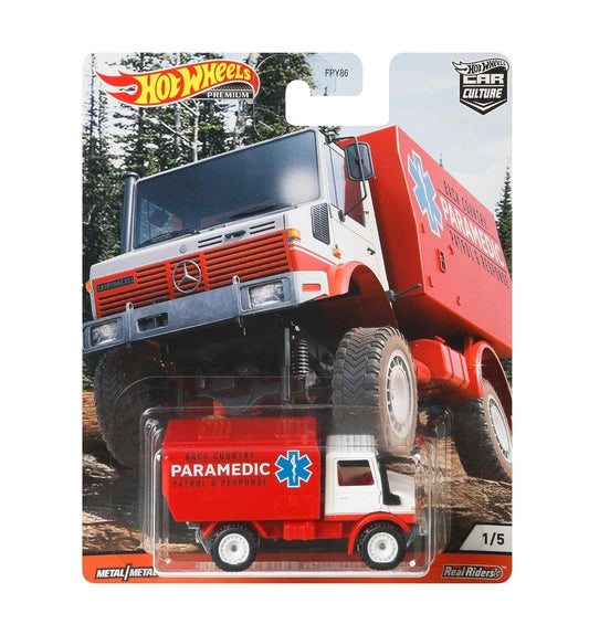 Hot Wheels Premium - Mercedes-Benz Unimog U1300 Paramedic - Series Wild Terrain - Scala 1/64