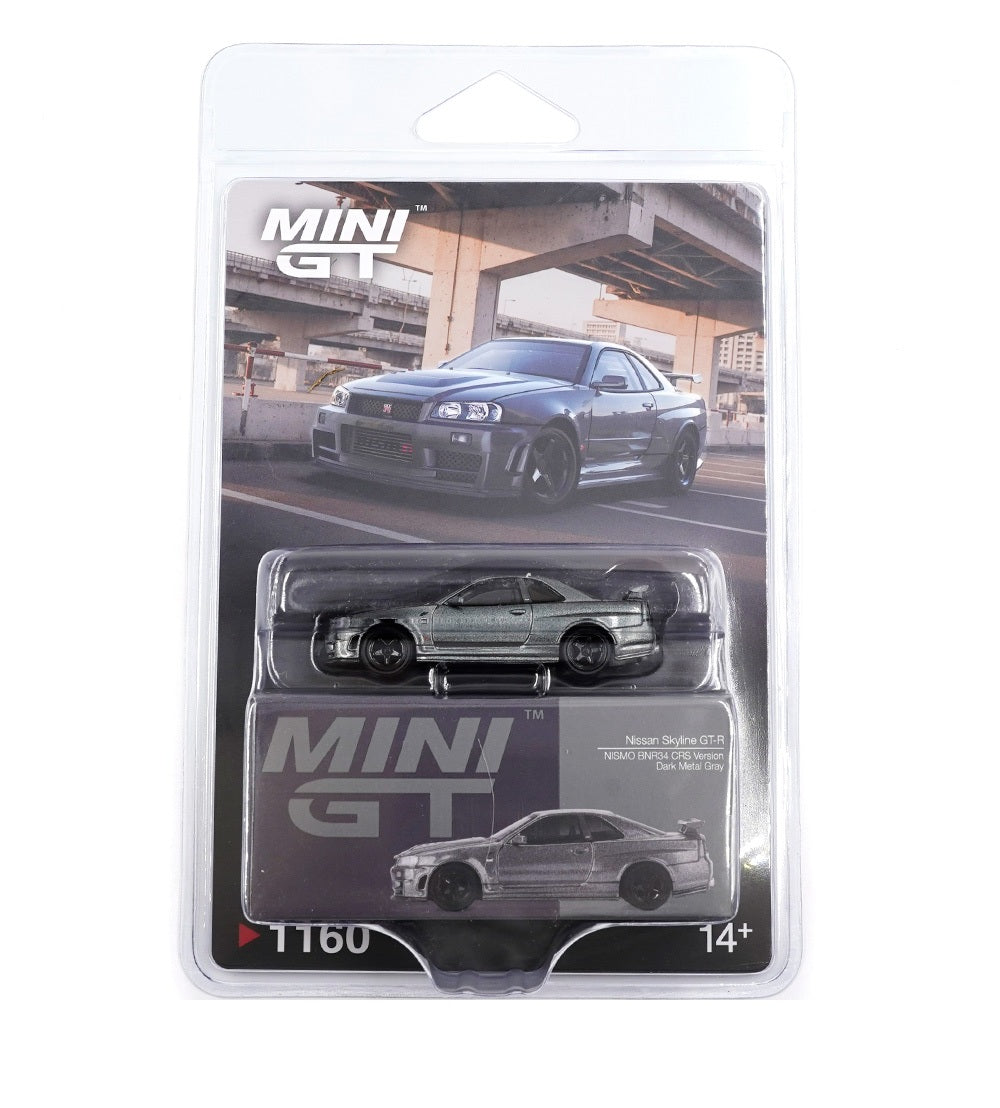 Mini GT - Nissan Skyline GT-R (R34) Dark Metal Gray Nismo CRS 1999 - Scala 1-64 MGT01160-BL Blister Packaging