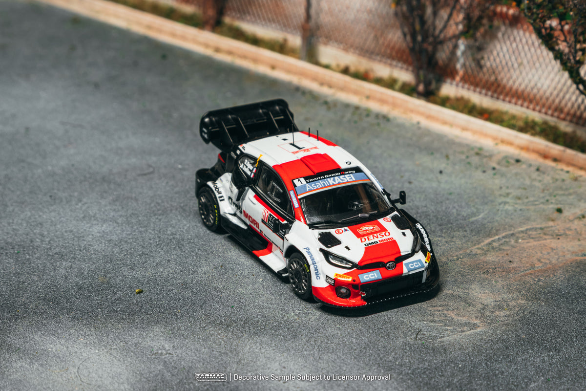 [PRE-ORDER] Tarmac Works - Toyota GR YARIS Rally1 HYBRID #1 SÉBASTIEN OGIER Rallye Monte-Carlo 2022 - HOBBY64 - Scala 1-64 T64-085-22MCR01